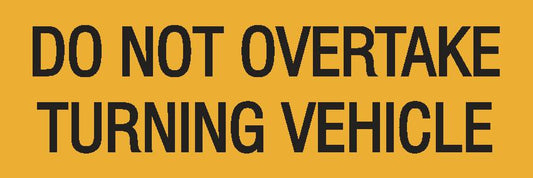 The Truck Do Not Overtake C1 Reflective 300 x 100 is a yellow sign with black text, "DO NOT OVERTAKE TURNING VEHICLE," made from C1 reflective material for enhanced visibility.