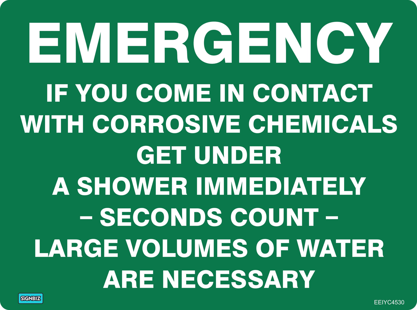 The Emergency Corrosive Use Shower sign features white text on green: "EMERGENCY—If exposed to corrosive chemicals, use the shower immediately. Large volumes of water are necessary. Quick action and safety equipment are essential.