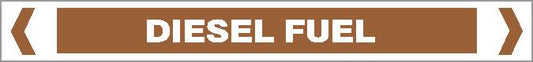 A brown rectangular Pipe Marker labeled "OILS - DIESEL FUELS" in white text, centered and bordered by white chevrons at each end.