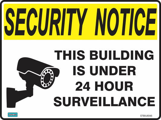 The Sec Notice Build Under 24hr Surv sign features a yellow "SECURITY NOTICE" header, a security camera image, and the message: "THIS BUILDING IS UNDER 24 HOUR SURVEILLANCE." Ideal for safety and security.