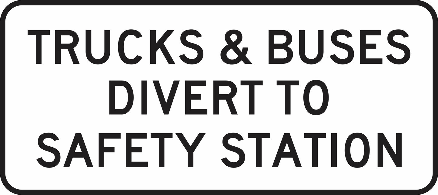 The G9-343n sign is a rectangular road sign with centered, all-capital black text on white: "TRUCKS & BUSES DIVERT TO SAFETY STATION.