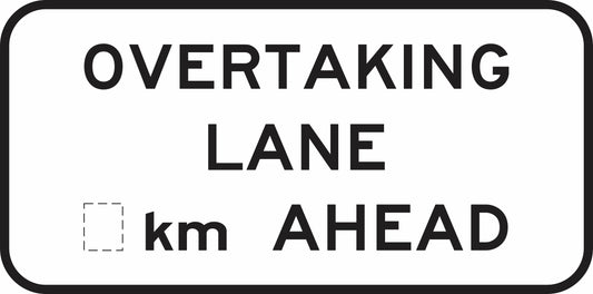 The G9-38 - Overtaking Lane __km Ahead sign is rectangular with a black border and displays: "OVERTAKING LANE [blank box] km AHEAD." The blank box is for entering the distance.