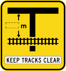 W7-12-3n - Rail Crossing On Side Road (symbolic - 'T' junction) Keep Tracks Clear