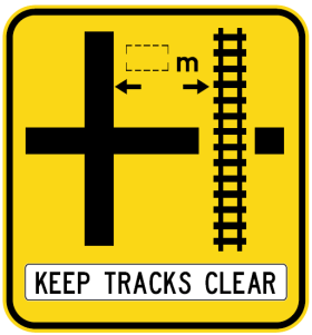 W7-13-2n(R) - Rail Crossing On Side Road (symbolic - 'Cross' junction Right) Keep Tracks Clear